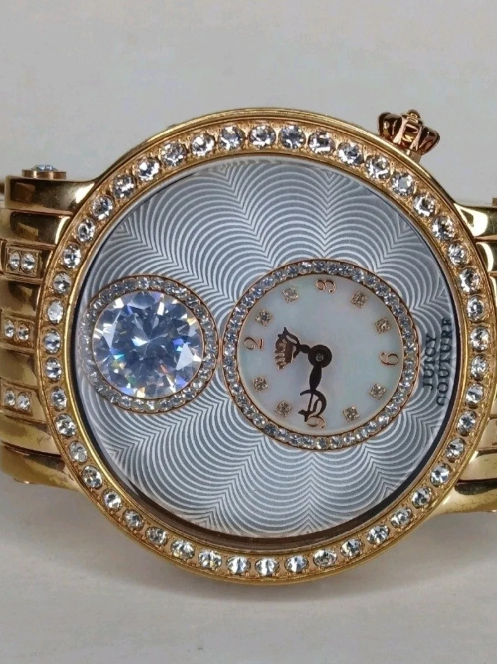 ​Juicy Couture Gold Tone Crystal Bezel Floating Solitaire Watch